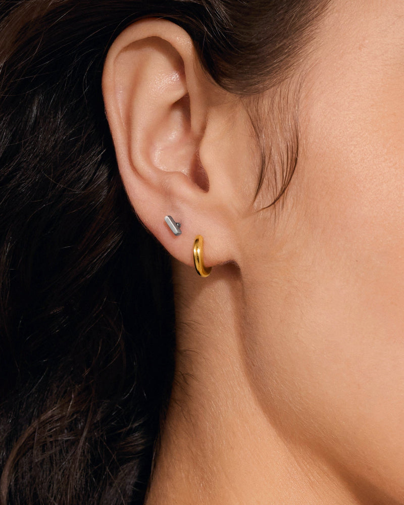 Small Huggie Hoop Earrings in Gold — titanium — Rhokea